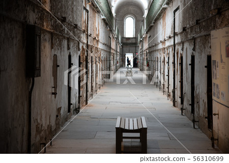 Prison corridor with cells on both sides Prison corridor with cells on both sides 56310699