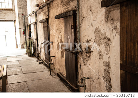 Entrance prison cells in a penitentiary Entrance prison cells in a penitentiary 56310718