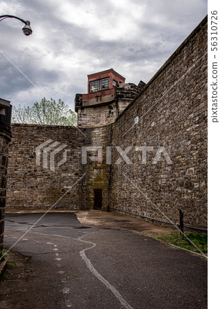 Watch tower of a penitentiary before a storm 56310726