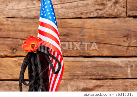 Black shoe with american flag and red poppy. Black shoe with american flag and red poppy. 56315313