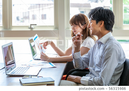 Viewing documents in front of a computer Business 56315986