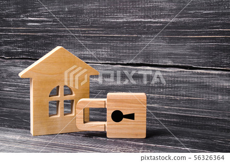 Wooden house with a padlock. House with a lock. Wooden house with a padlock. House with a lock. 56326364