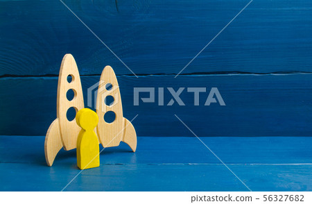 A golden man stands near missiles A golden man stands near missiles 56327682