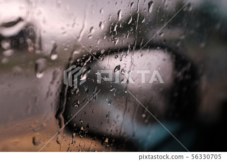 Rainy day car side mirror and water drop 56330705