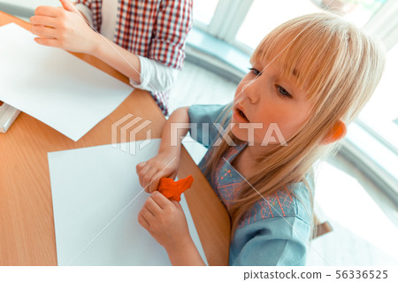 Pleasant blonde girl being ready to draw Pleasant blonde girl being ready to draw 56336525