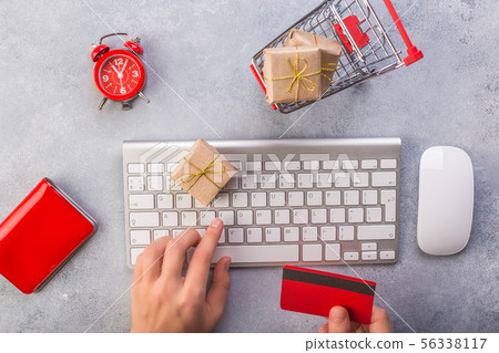 Woman hands ordering gifts online, paying by credit card. Concept online shopping buying presents Woman hands ordering gifts online, paying by credit card. Concept online shopping buying presents 56338117