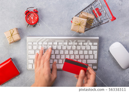 Woman hands ordering gifts online, paying by credit card. Concept online shopping buying presents Woman hands ordering gifts online, paying by credit card. Concept online shopping buying presents 56338311