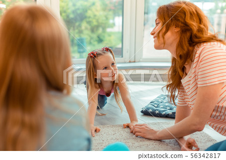 Joyful happy girl smiling to her teacher 56342817