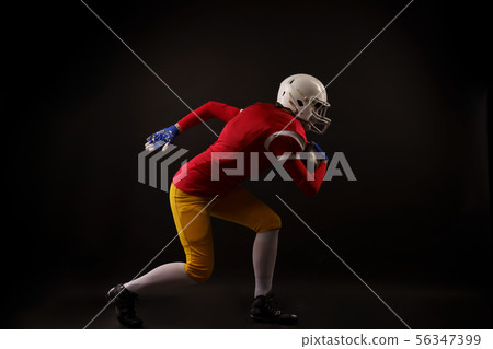 Side view of running sportswoman in white helmet in studio Side view of running sportswoman in white helmet in studio 56347399