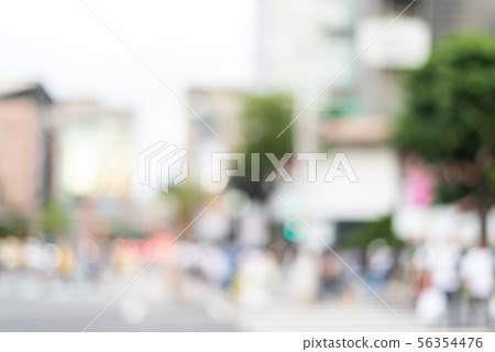 blurred city scenery with people walking 56354476