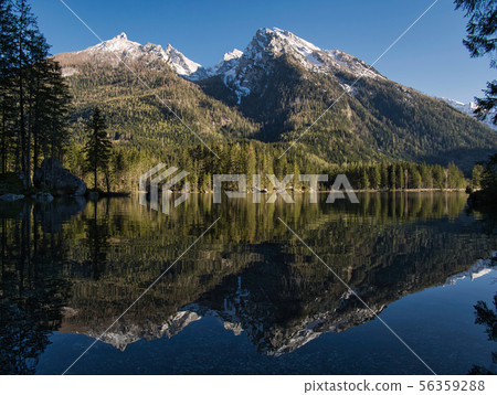 The mountains are reflected in the clear lake 56359288