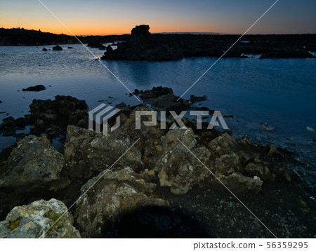 Several Lava stalks at the lake of a thermal bath 56359295