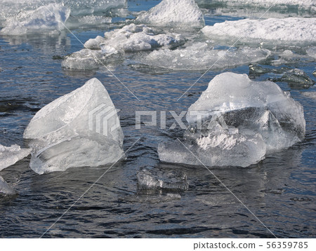 Floating chunks of ice from the glacier in Iceland Floating chunks of ice from the glacier in Iceland 56359785