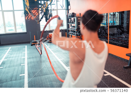 Close up of ropes being in male hands 56371140