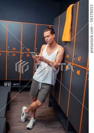 Good looking young man leaning on the locker Good looking young man leaning on the locker 56376053