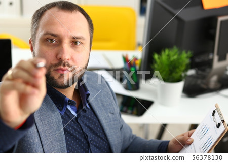 portrait of young handsome promising businessman in office portrait of young handsome promising businessman in office 56378130