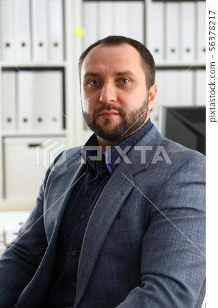 portrait of young handsome promising businessman in office 56378217