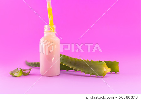 Aloe Vera plant and gel in a glass bottle for 56380878