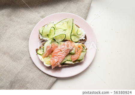 Tasty fresh sandwich with red fish, feta cheese 56380924