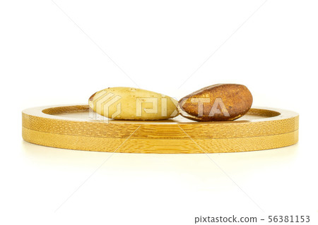 Unshelled brazil nut isolated on white Unshelled brazil nut isolated on white 56381153