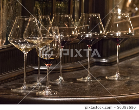 Glasses of elite wine on the bar in dark interior 56382680