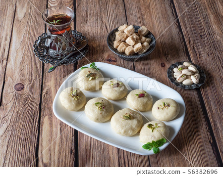 Peda (Indian sweet), Milk Fudge with tea cup  56382696