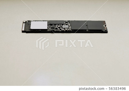 SSD drive on a gray neutral background. SSD drive on a gray neutral background. 56383496