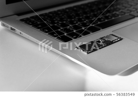Chip SSD drive in the left corner of the laptop. Chip SSD drive in the left corner of the laptop. 56383549