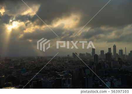 Japan's Tokyo cityscape Sunlight in the Tokyo metropolitan area with dark clouds (influenced by large typhoon # 10, rain clouds in the Tokyo metropolitan area) 56397103
