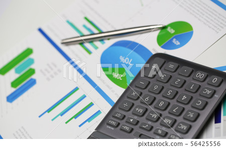 Silver calculator and financial statistics on clipboard 56425556