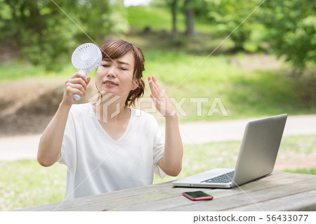 A woman in fresh green 56433077