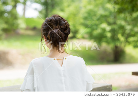 A woman in fresh green A woman in fresh green 56433079