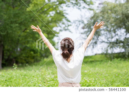 A woman in fresh green A woman in fresh green 56441100