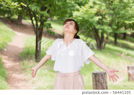 A woman in fresh green A woman in fresh green 56441105