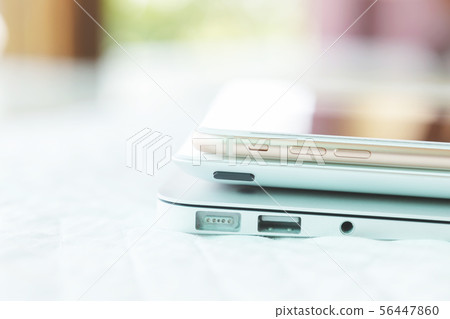 Stacked of digital devices, laptop, tablet and Stacked of digital devices, laptop, tablet and 56447860