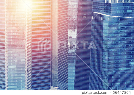 Modern building reflected on a blue glass wall Modern building reflected on a blue glass wall 56447864