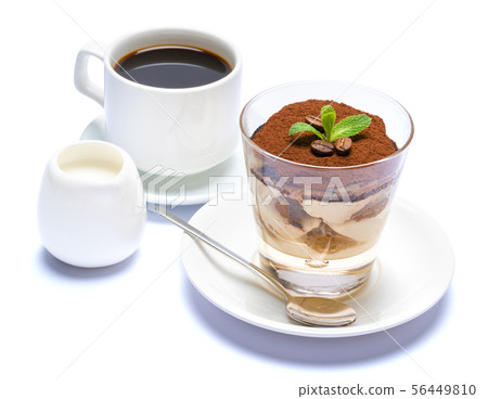Classic tiramisu dessert in a glass, cup of espresso coffee and cream isolated on white background Classic tiramisu dessert in a glass, cup of espresso coffee and cream isolated on white background 56449810