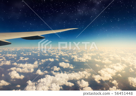 View of beautiful sunny clouds and wing of View of beautiful sunny clouds and wing of 56451448
