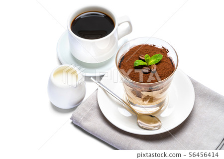 Classic tiramisu dessert in a glass, cup of espresso coffee and cream isolated on white background Classic tiramisu dessert in a glass, cup of espresso coffee and cream isolated on white background 56456414
