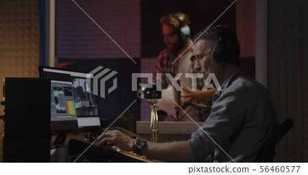 Foley artist working in studio 56460577