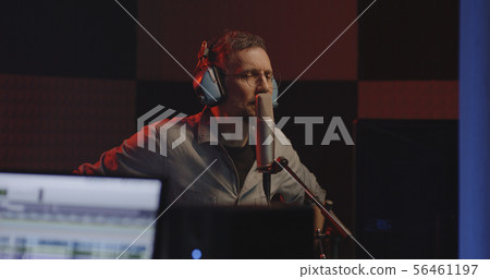 Actor doing voice over in sound studio Actor doing voice over in sound studio 56461197