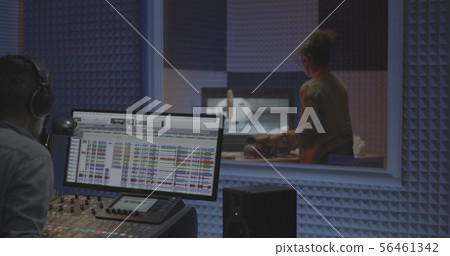 Foley artist and sound engineer working in studio Foley artist and sound engineer working in studio 56461342