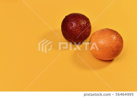 Two red oranges. Two red oranges. 56464995