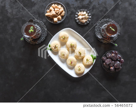 Pedha (Indian sweet), Milk Fudge on a black table 56465072