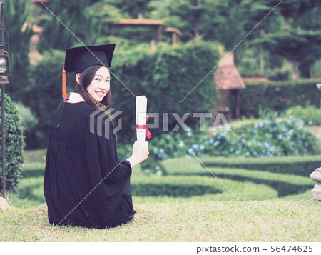 Graduate put hands up celebrate with certificated Graduate put hands up celebrate with certificated 56474625