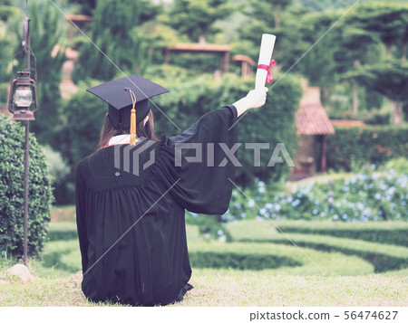 Graduate put hands up celebrate with certificated Graduate put hands up celebrate with certificated 56474627