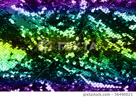 Shining iridescent sequins on fabric. Festive 56490021