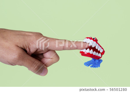 funny denture biting a finger funny denture biting a finger 56501280
