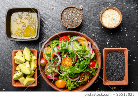 Top view at Clay dish with vegetable salad of 56515025