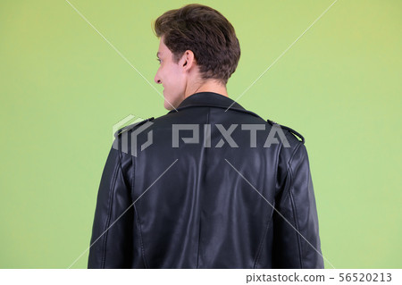 Closeup profile view of young handsome rebellious man Closeup profile view of young handsome rebellious man 56520213